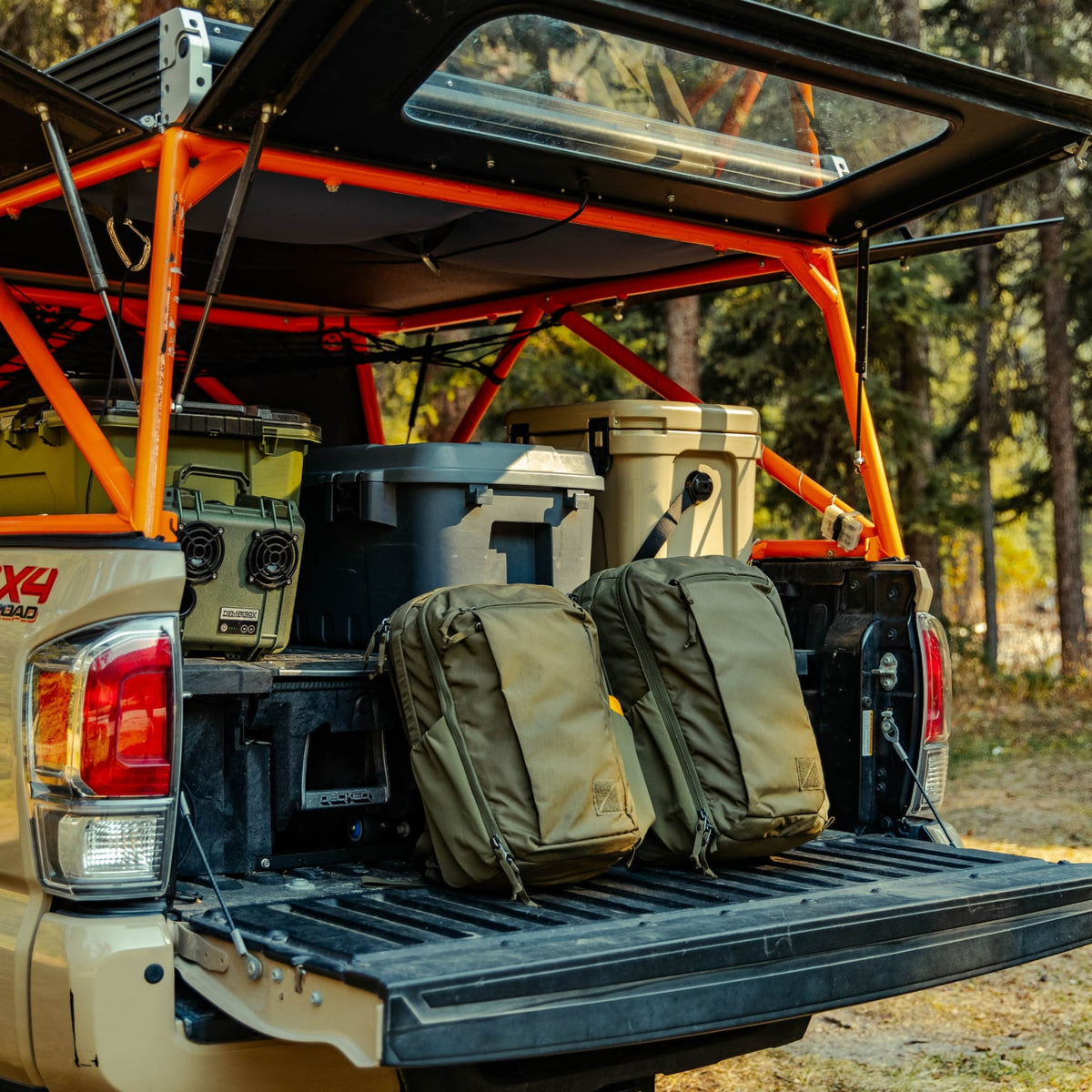 CIVIC Travel Bag 26L in OD Green next to CIVIC Travel Bag 20L in OD Green on truck bed CIVIC Travel Bag 26L in OD Green next to CIVIC Travel Bag 20L in OD Green on truck bed [13019c-ODG, 13012c-ODG