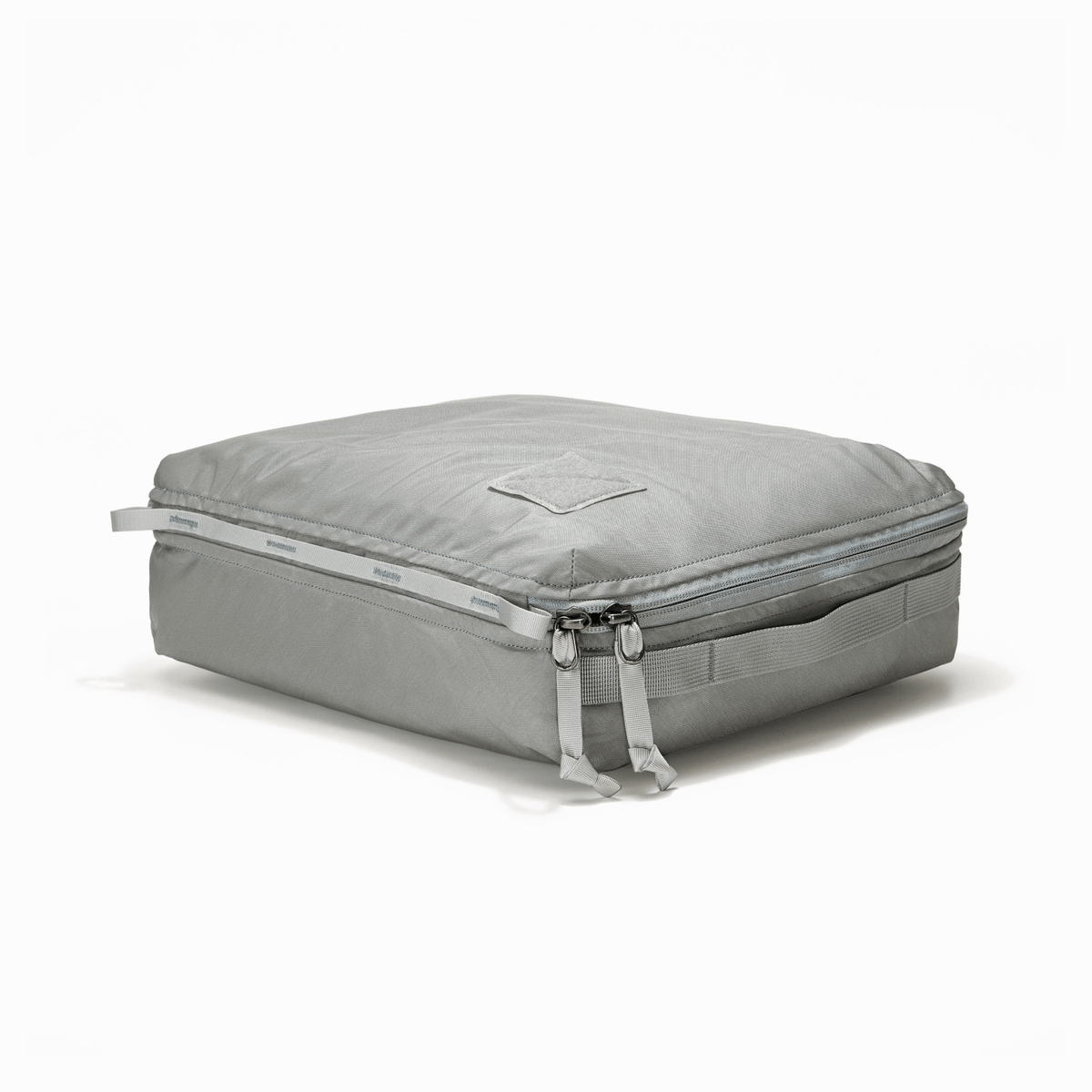 Transit Packing Cube 10L in Standard Gray - packed and laid flat Transit Packing Cube 10L in Standard Gray - packed and laid flat [13021a-STG