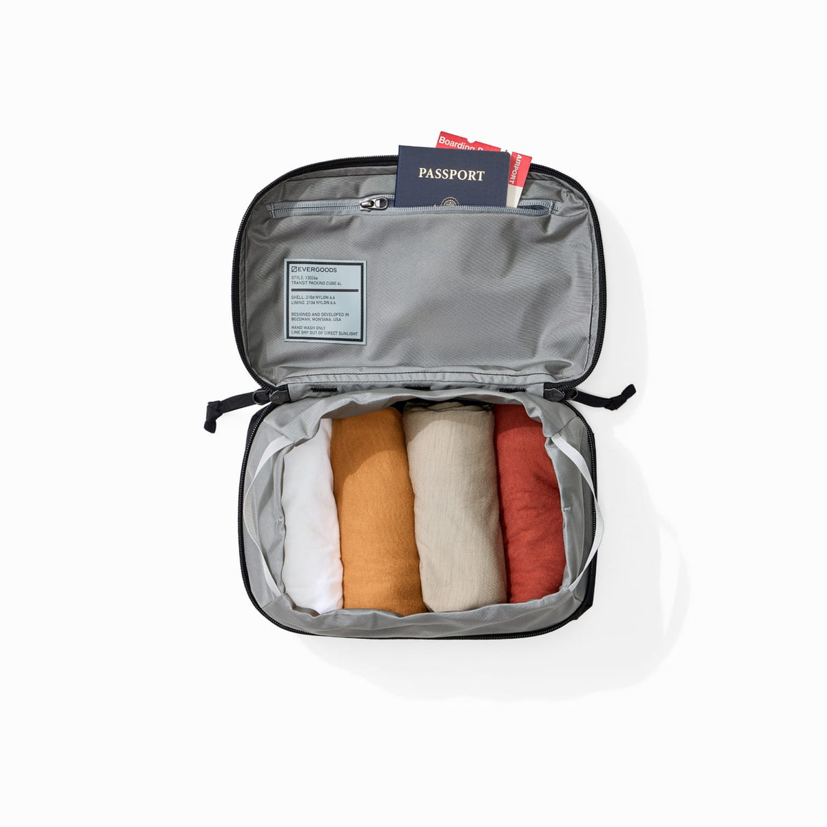 Transit Packing Cube 4L in Black - open and packed with travel documents Transit Packing Cube 4L in Black - open and packed with travel documents [13026a-BLK