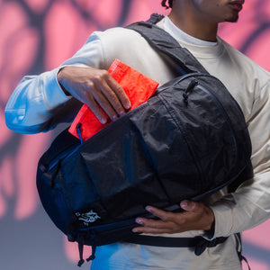 CIVIC Flat Pouch - CFP - in Electric Coral - Stowed in front side-access pocket of backpack