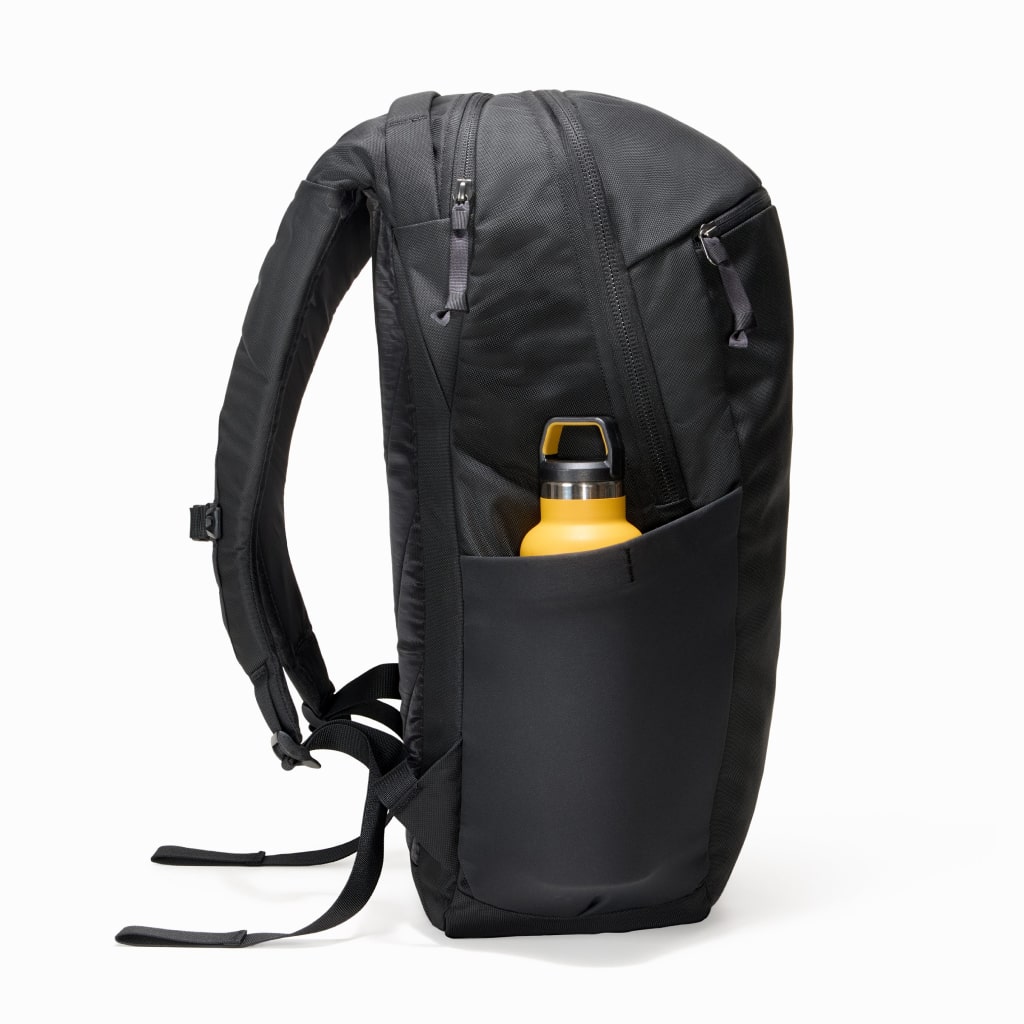 CIVIC Half Zip 26l in Solution Dyed Black - side view with water bottle [13005d-SBK]