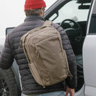 Person with a Fossil Brown CIVIC Travel Bag 20L backpack getting into a vehicle Person with a Fossil Brown CIVIC Travel Bag 20L backpack getting into a vehicle [13019c-FBN
