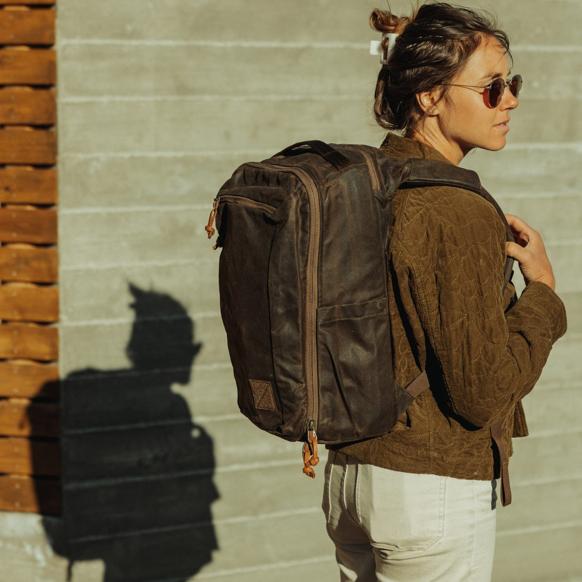 CIVIC Travel Bag 20L in Waxed Canvas - Waxed Tan - quarter profile worn [13019cc-WTN]