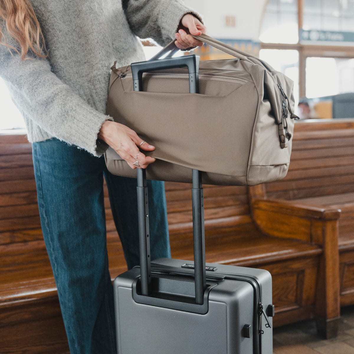 Transit Duffel 25L in Fossil Brown - luggage pass through in use [13023d-FBN]