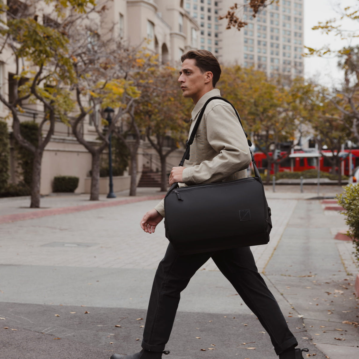 Transit Duffel 35L in Solution Dyed Black - over shoulder strap carry [13014d-SBK]