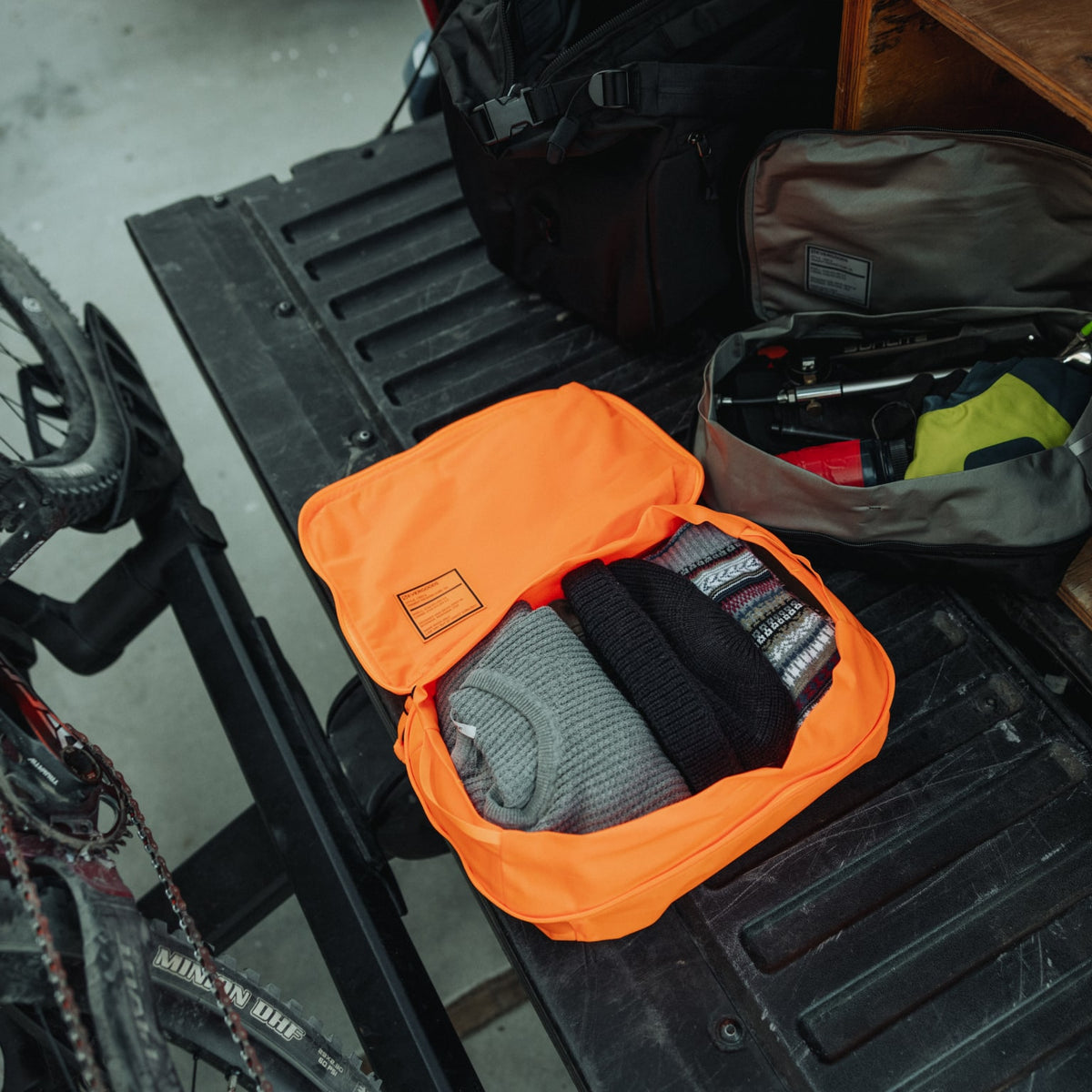 Transit Packing Cube 10L in Hot Orange - packed, wide open, and flat [13021a-HTO]